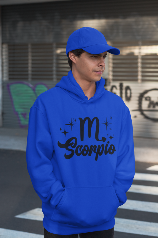 Person wearing a blue hoodie with 'Scorpio' black text design, standing on a street.
